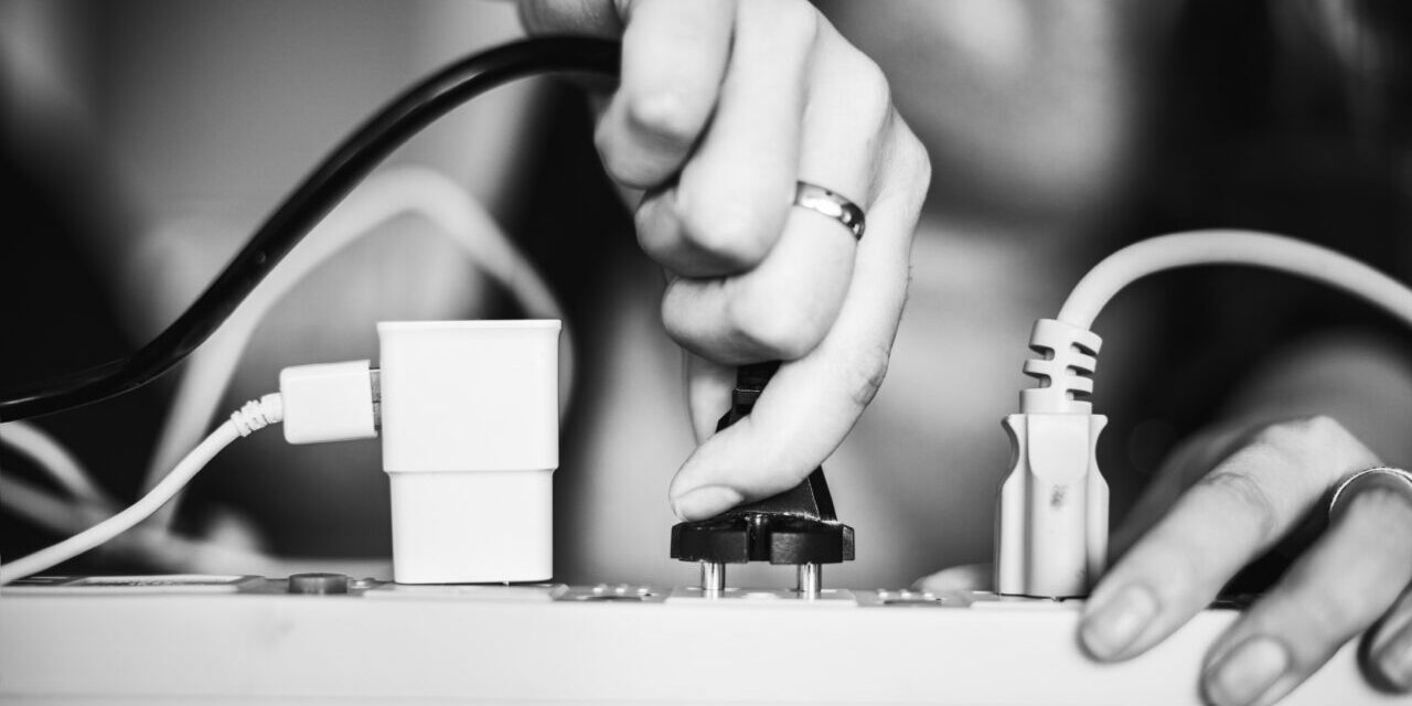 Woman plugging the wire