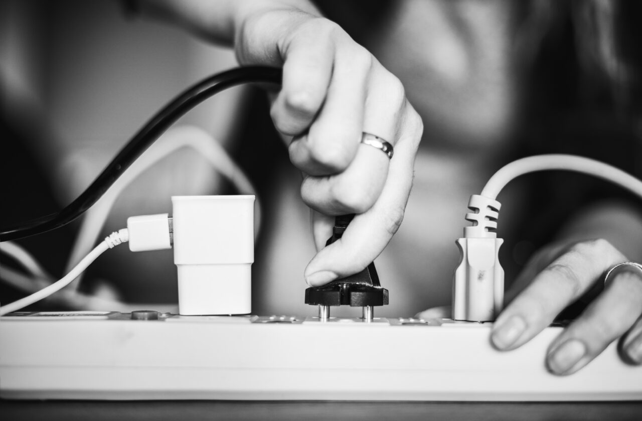 Woman plugging the wire