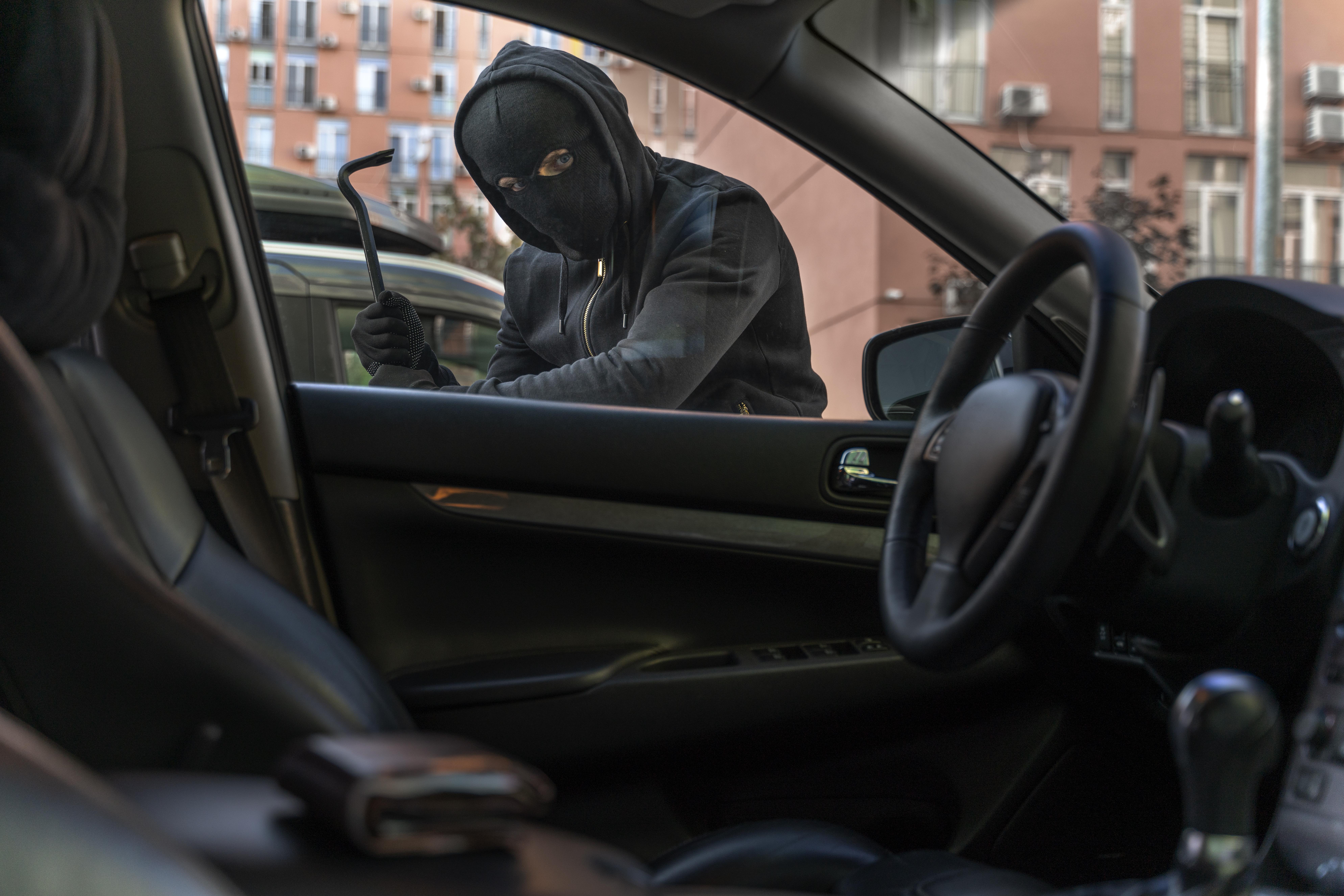 close-up-man-trying-break-into-car